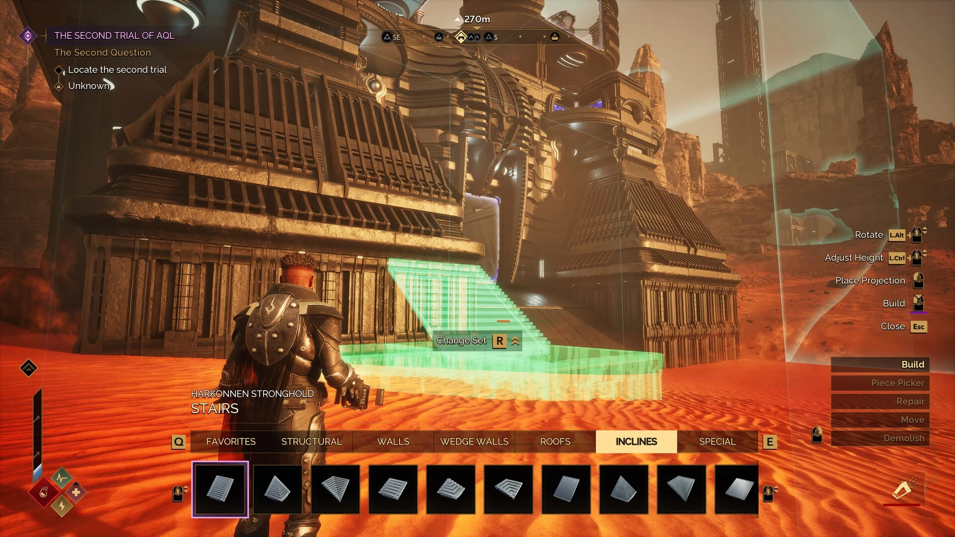 Un personaje coloca una escalera translúcida frente a una fortaleza Harkonnen, con la barra de piezas de construcción en la parte baja