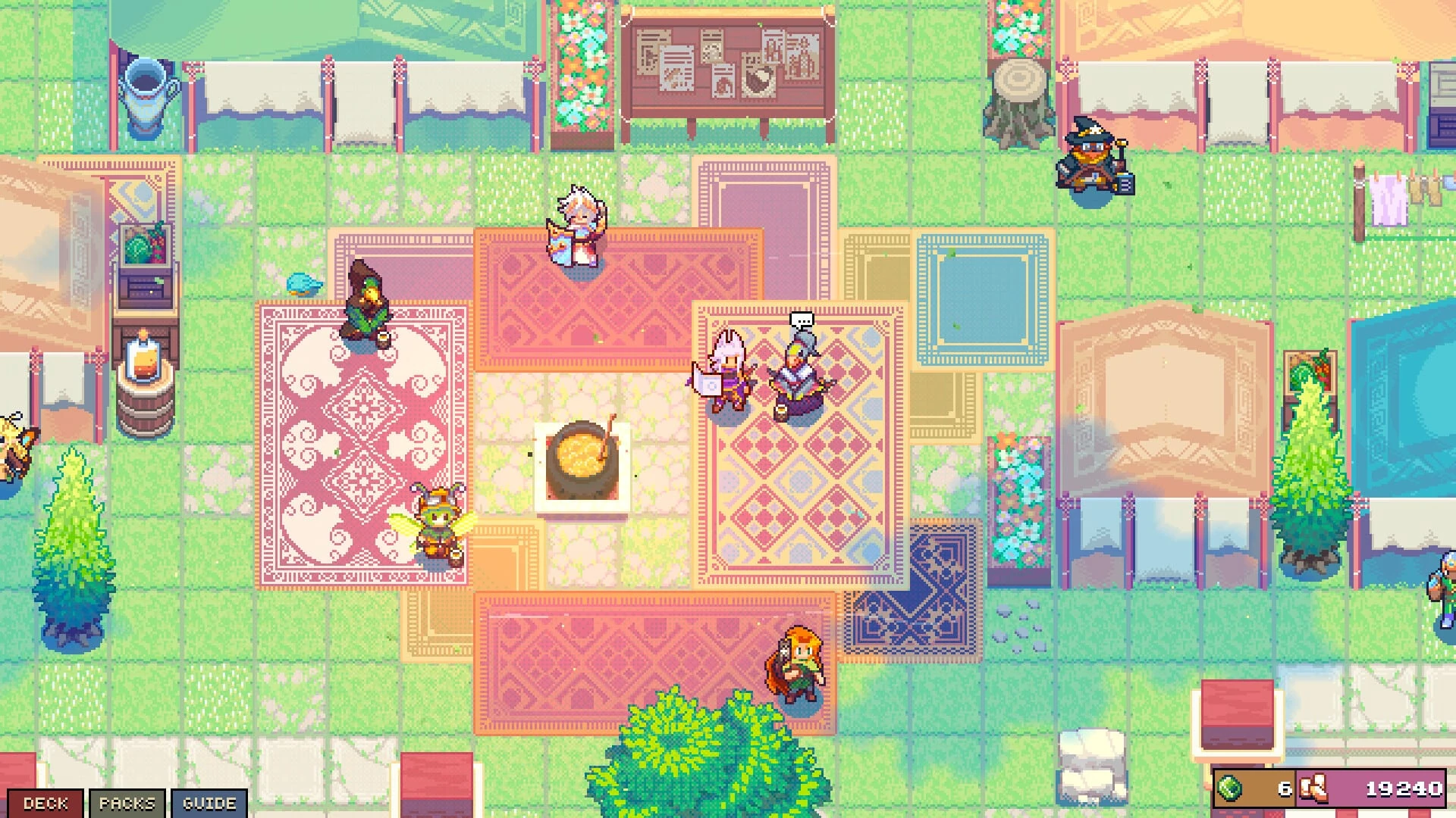 Plaza del pueblo vista desde arriba, con alfombras de colores sobre la hierba, un caldero en el centro, puestos con toldos y varios aventureros paseando