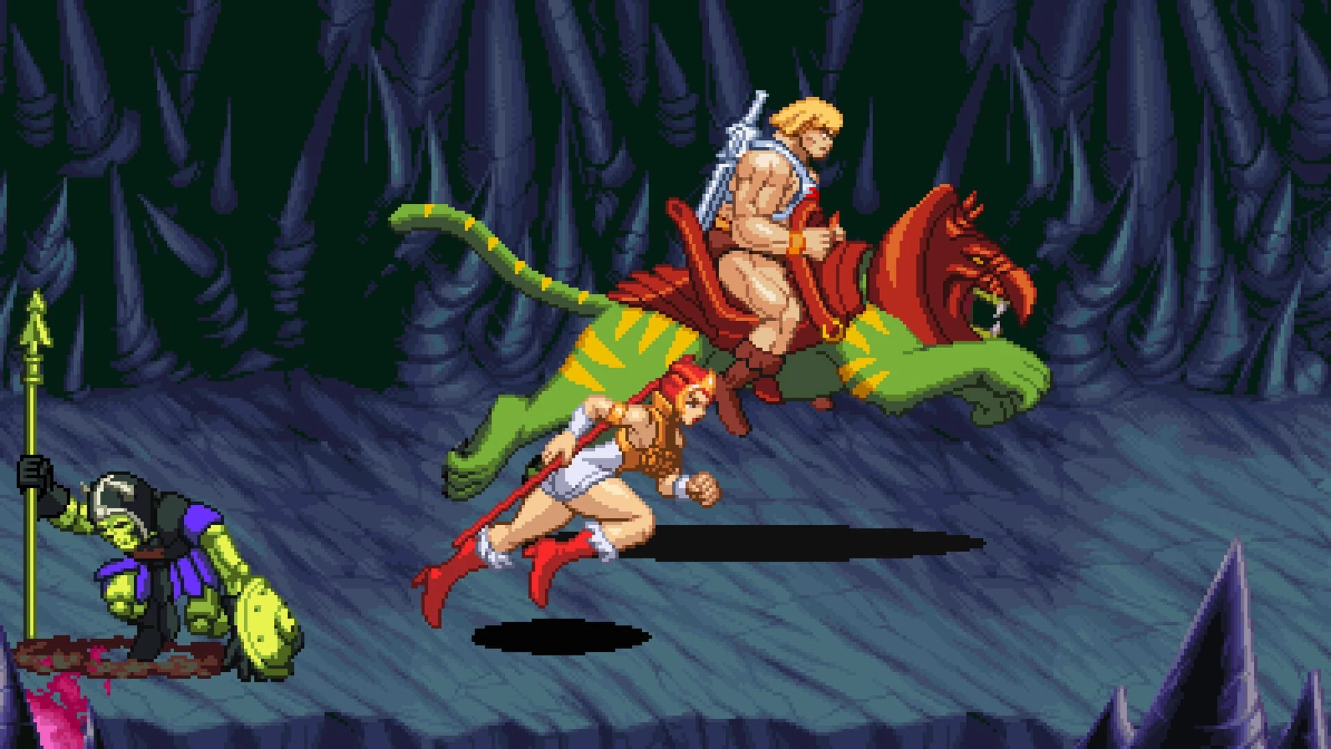 He-Man cabalga a lomos de Battle Cat por una caverna azul mientras Teela corre a su lado con su bastón