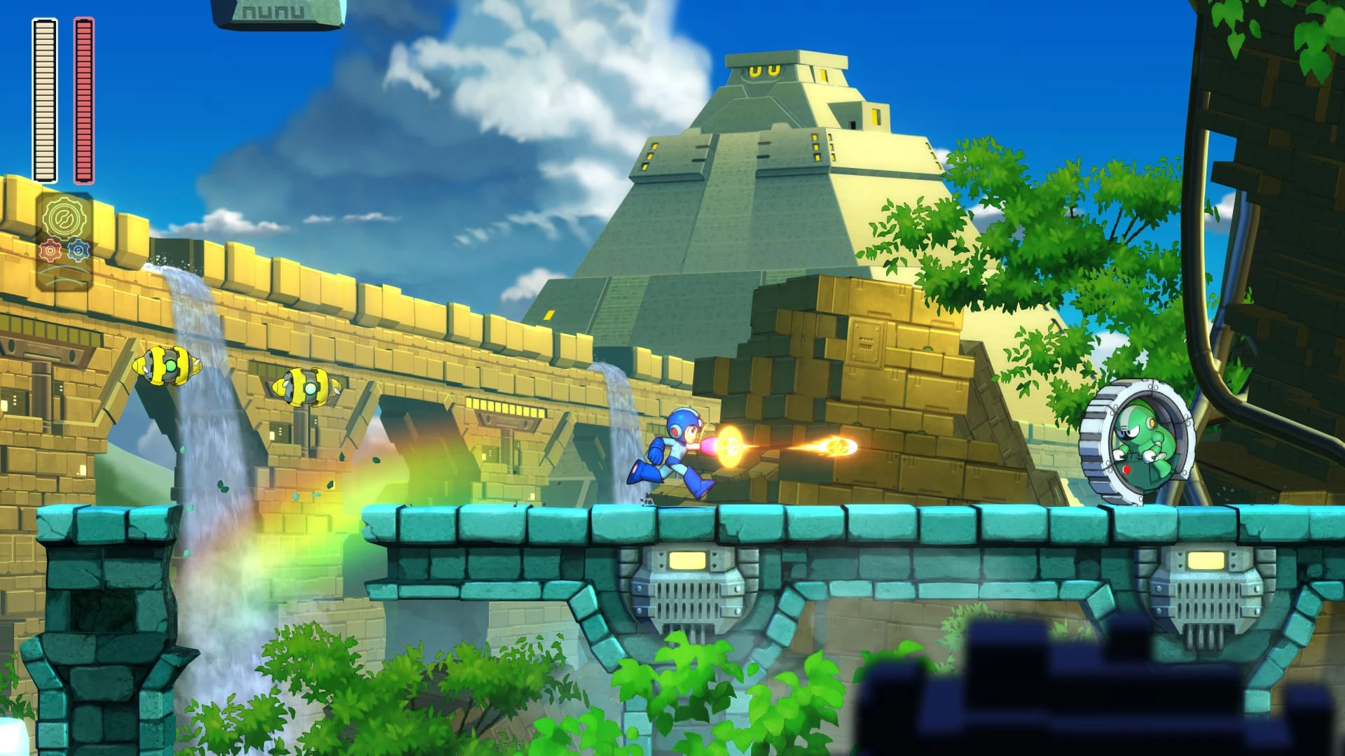 Mega Man dispara sobre un puente de piedra en una selva, con una pirámide escalonada y una cascada al fondo bajo un cielo con nubes