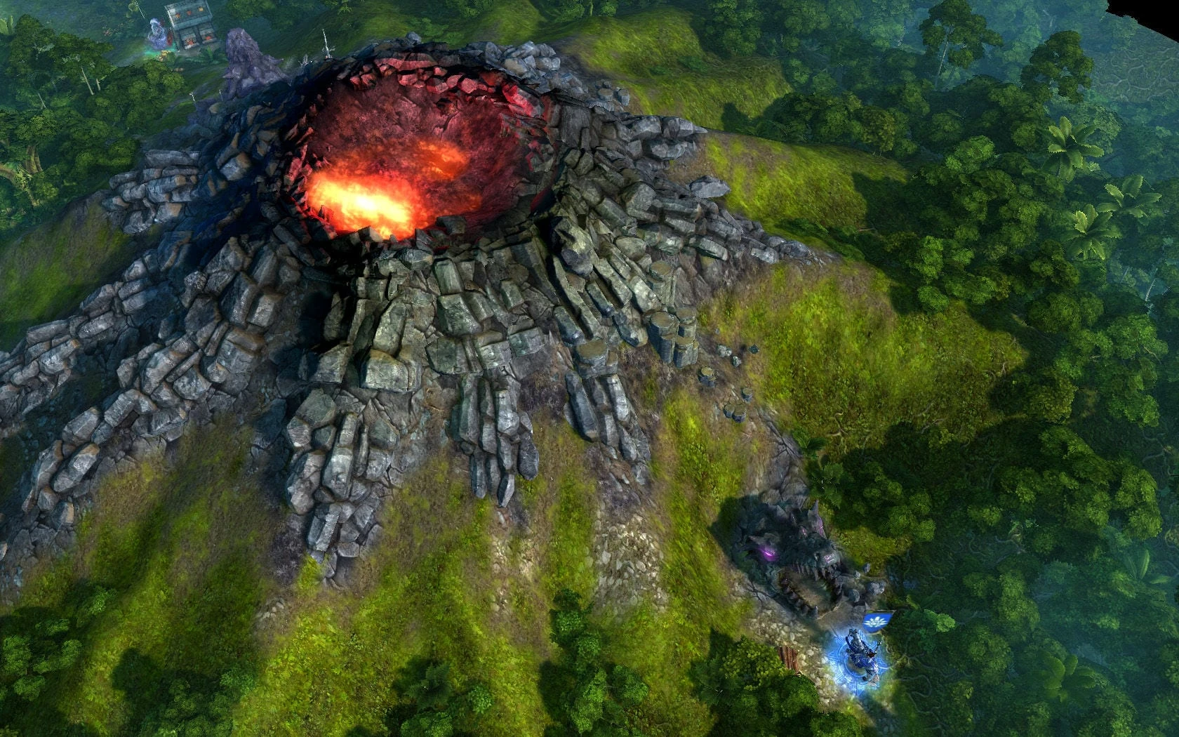 Un volcán de roca gris con el cráter encendido en medio de un valle verde