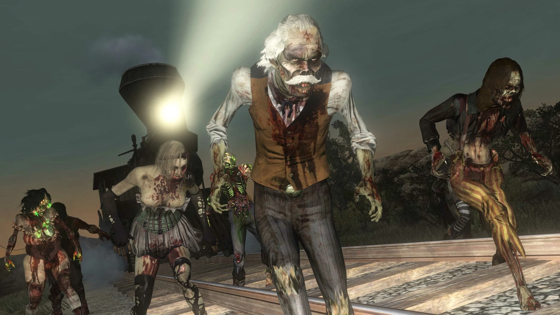 Zombis vestidos del Oeste, con un anciano de bigote blanco al frente, caminan por unas vías hacia la cámara con el faro de una locomotora detrás