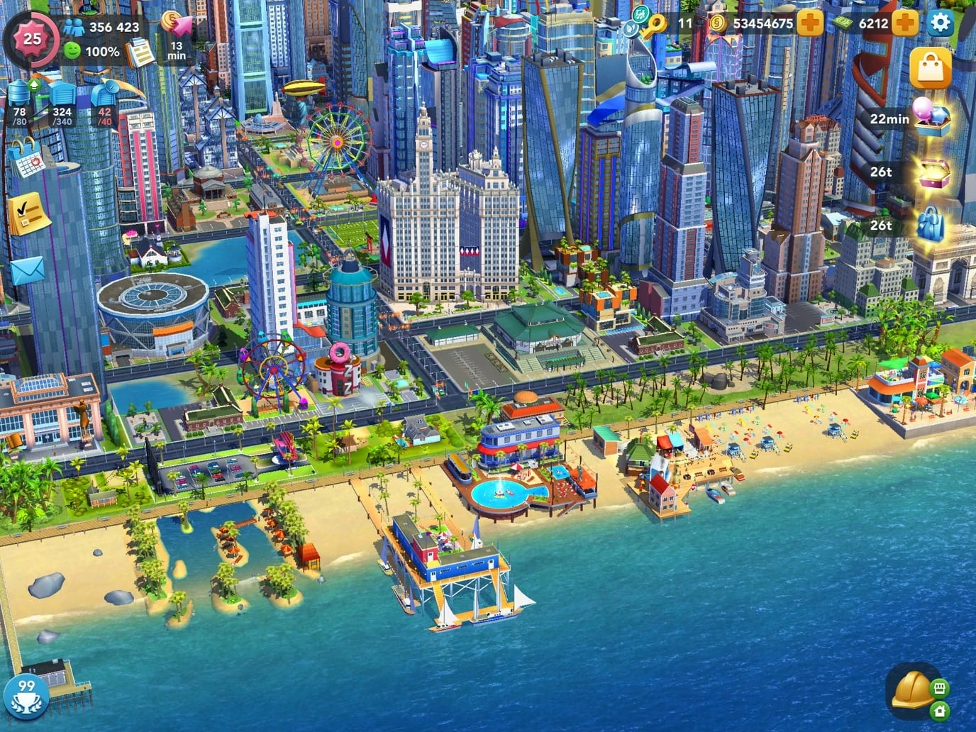 Ciudad costera de SimCity BuildIt con rascacielos, dos norias, un estadio y una playa con muelle