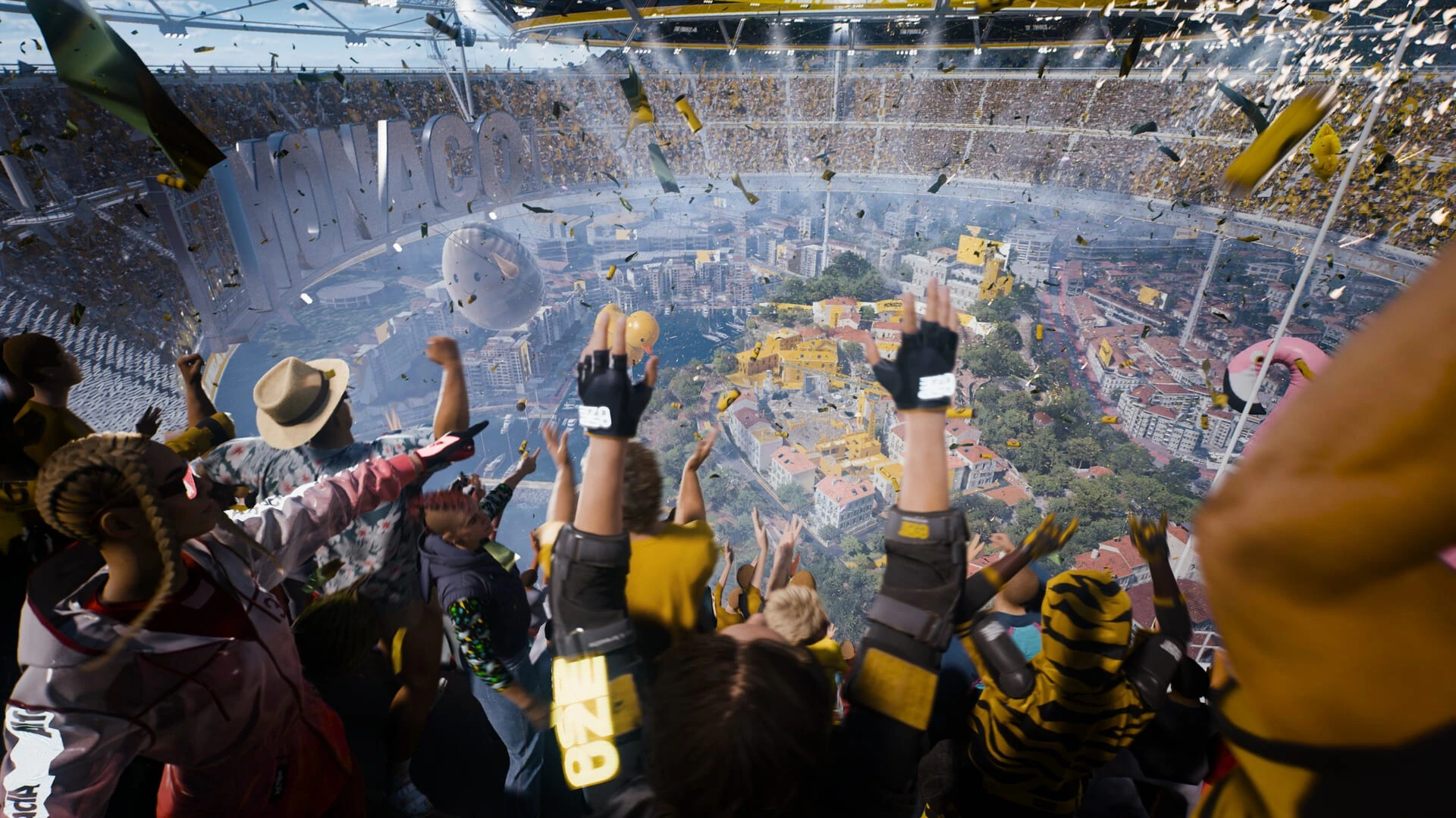 Concursantes con los brazos en alto en lo alto de un estadio gigante bajo una lluvia de confeti, con la arena de Mónaco a sus pies
