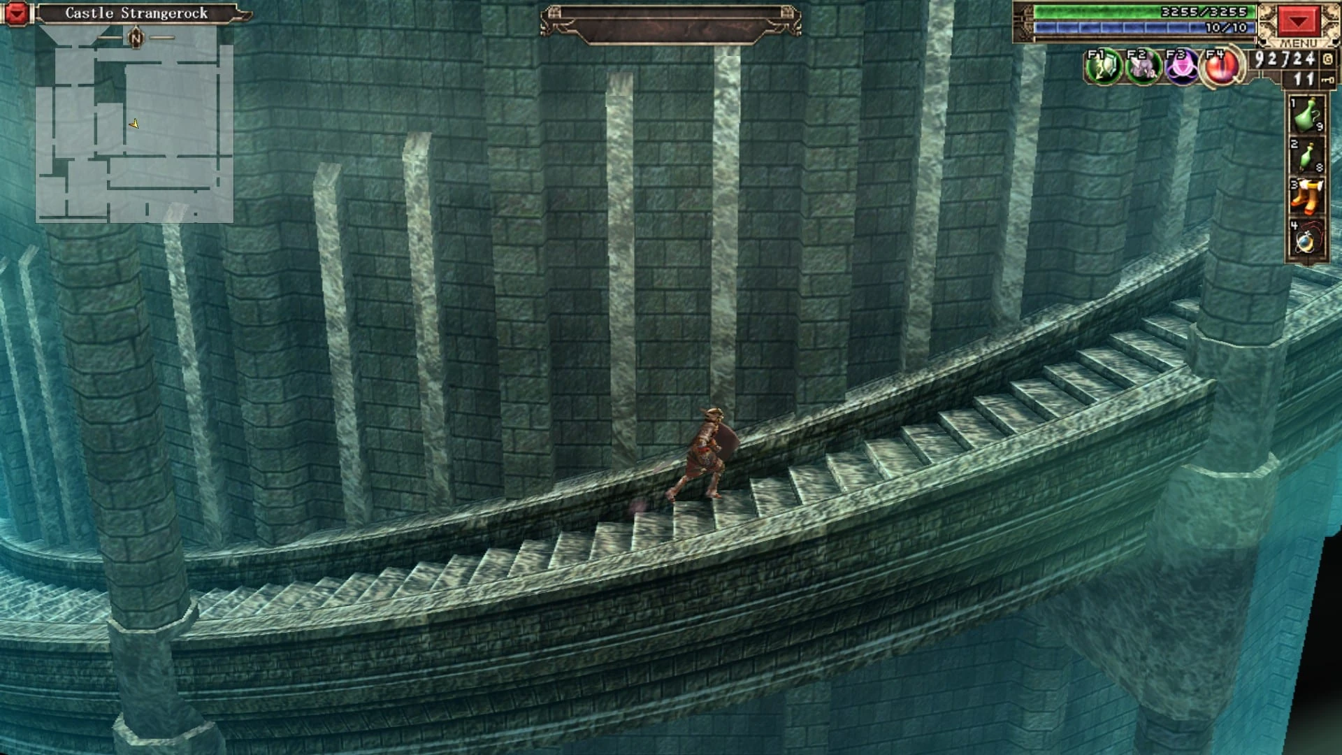 Interior de castillo en verde azulado con una escalinata curva de piedra y columnas, por la que sube un personaje diminuto
