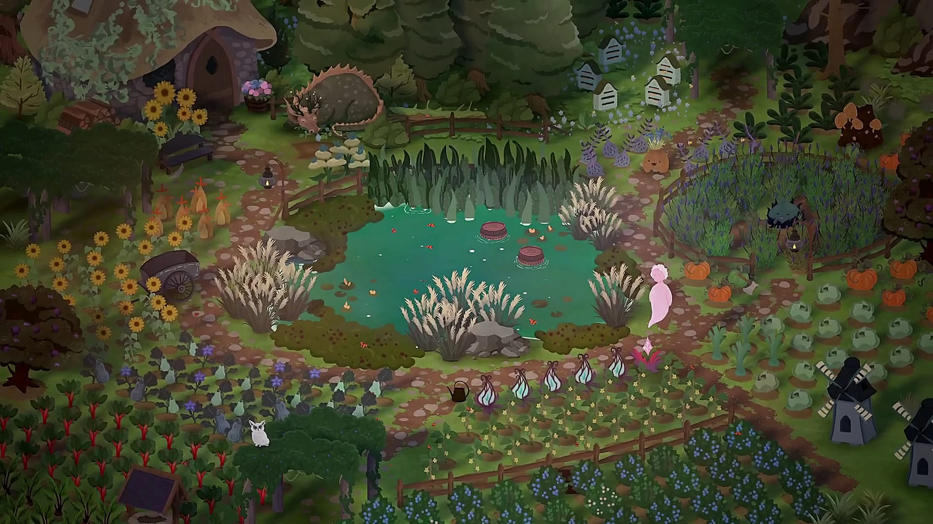 El huerto de la universidad visto desde arriba: bancales de hortalizas, girasoles, un estanque, molinillos y un espíritu rosa