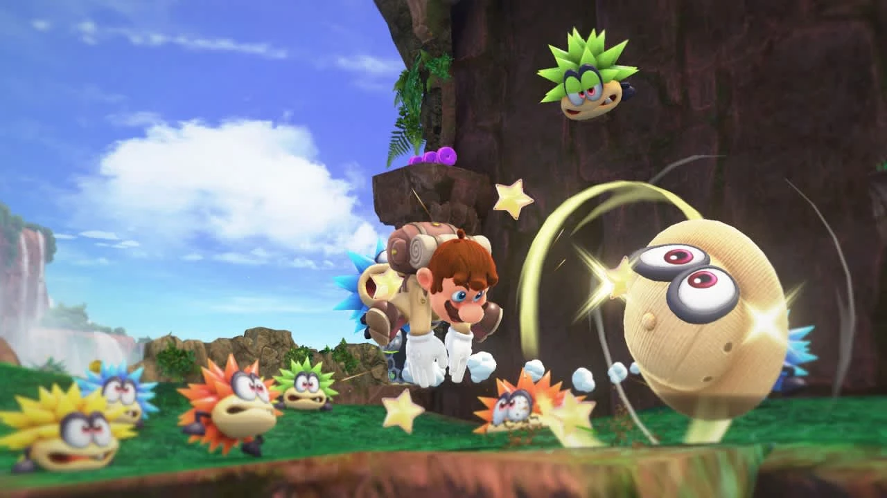 Mario lanza a Cappy contra una criatura redonda en una pradera, rodeado de erizos de colores, en Super Mario Odyssey